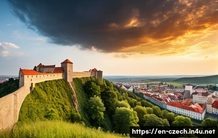 브르노의 역사적 명소 - A panoramic view of Brno’s medieval fortifications featuring the massive stone walls of Castle Špilb...